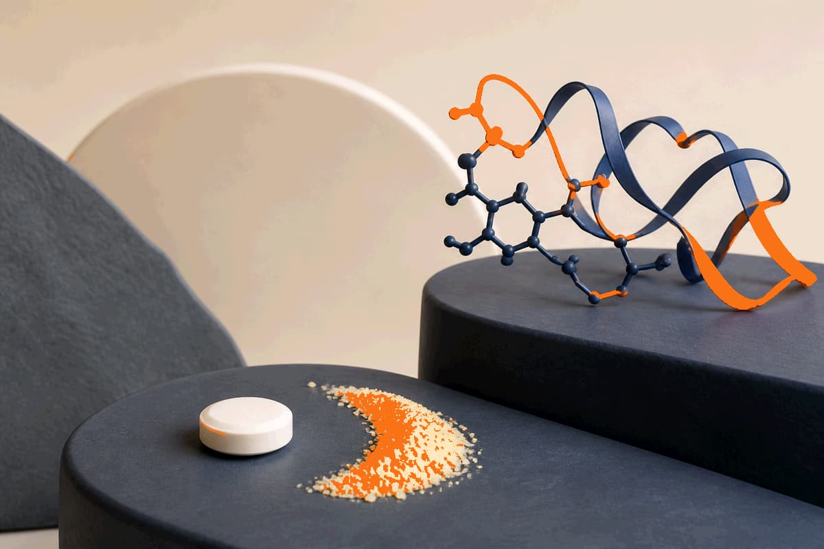 White riboflavin tablet beside pale yellow crystalline vitamin B2 powder and a luminous flavin-inspired molecular ribbon on cream and deep navy surfaces